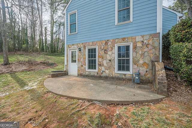 back of property featuring a patio area