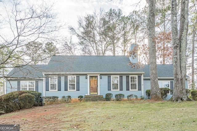 ranch-style house featuring a front yard