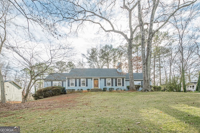 single story home with a front lawn