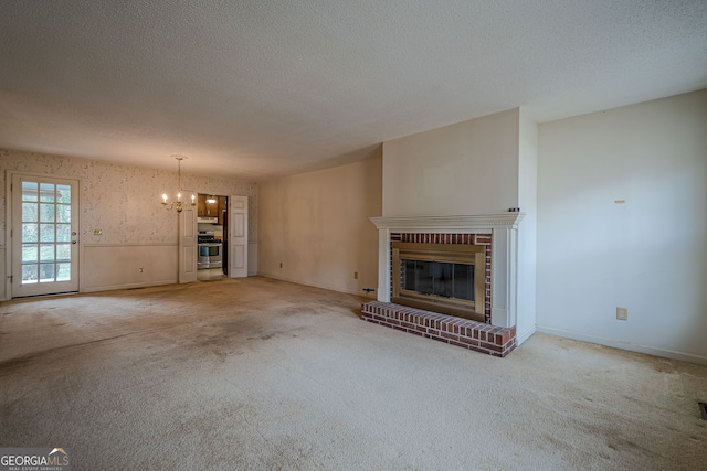 unfurnished living room with a fireplace, a textured ceiling, and carpet flooring