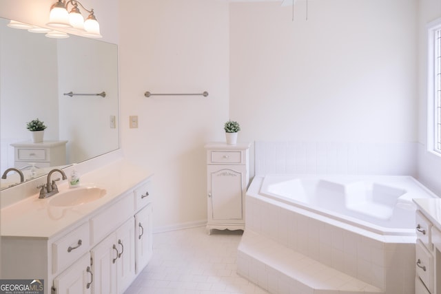 bathroom with vanity, tiled bath, and tile patterned floors