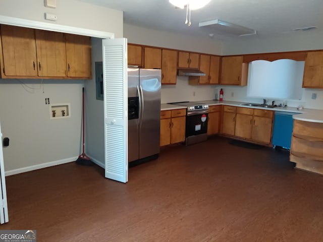 kitchen with sink, dark wood-type flooring, and appliances with stainless steel finishes