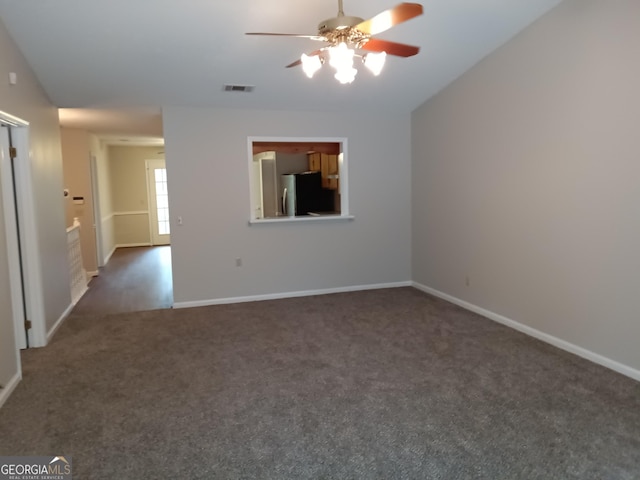 carpeted empty room featuring ceiling fan