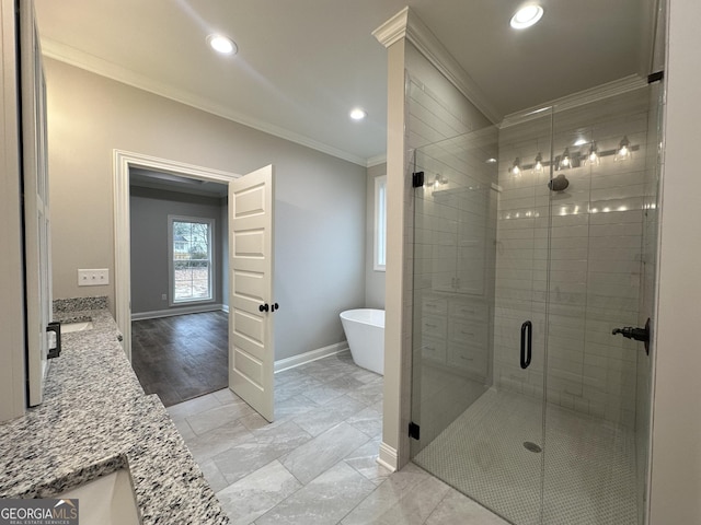 bathroom with crown molding, vanity, and plus walk in shower