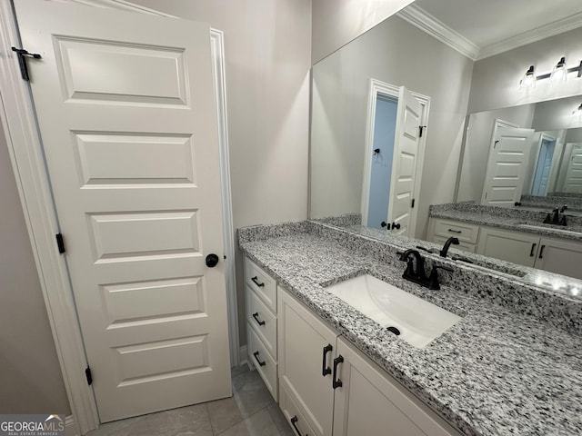 bathroom with crown molding and vanity