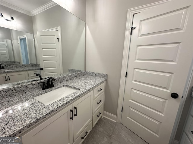 bathroom featuring ornamental molding and vanity