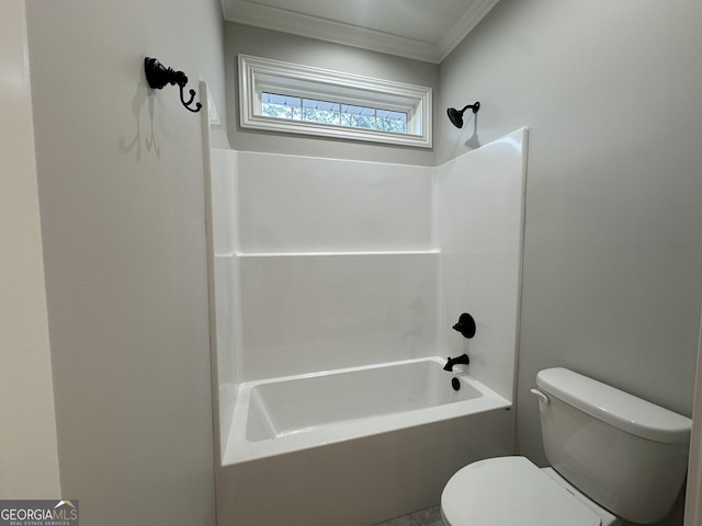 bathroom featuring shower / washtub combination, crown molding, and toilet