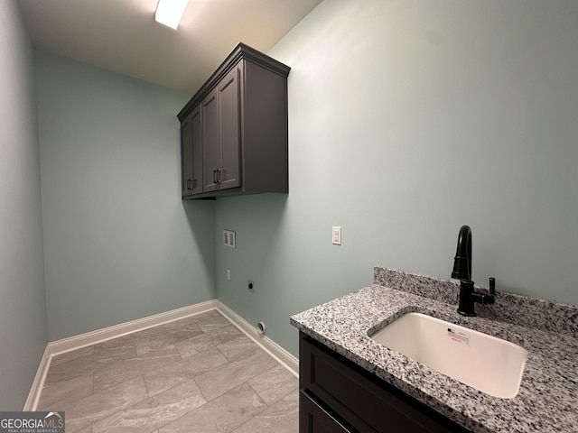 laundry room featuring washer hookup, sink, cabinets, and electric dryer hookup