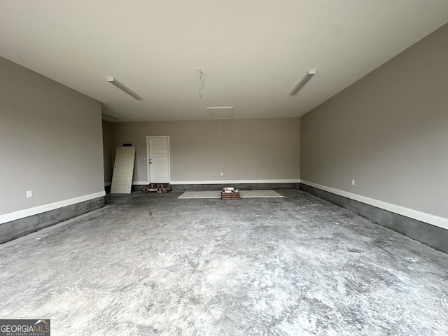 unfurnished room with concrete flooring