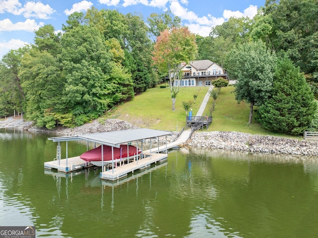 dock area featuring a yard and a water view