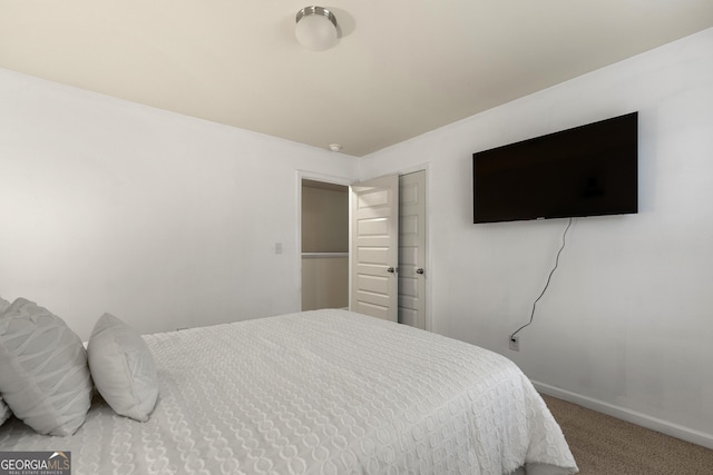 bedroom featuring carpet floors and a closet