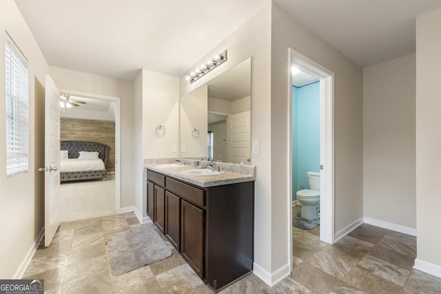 bathroom with vanity, plenty of natural light, and toilet