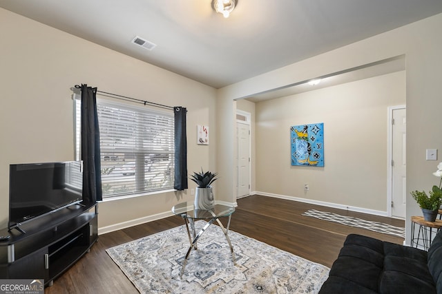 living room featuring dark hardwood / wood-style flooring