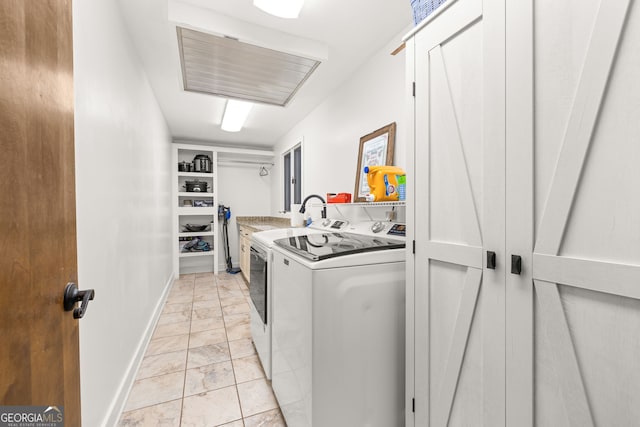 laundry room featuring washer and clothes dryer