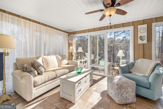 sunroom with wooden ceiling and ceiling fan