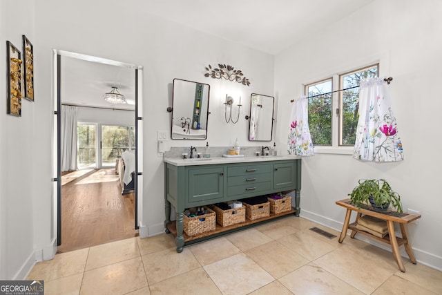 bathroom featuring tile patterned flooring and vanity