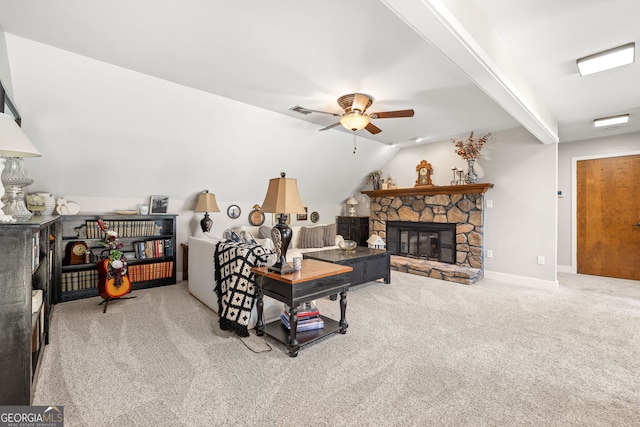 carpeted living room featuring a fireplace, lofted ceiling with beams, and ceiling fan