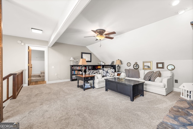 carpeted living room with vaulted ceiling and ceiling fan