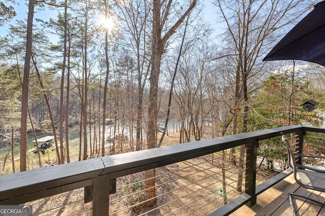 wooden deck featuring a water view