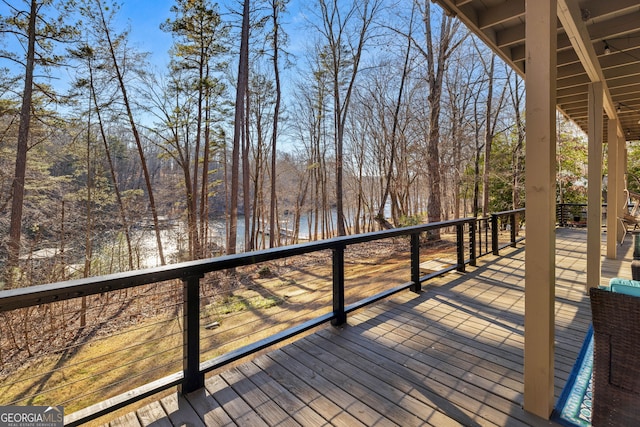 wooden deck with a water view