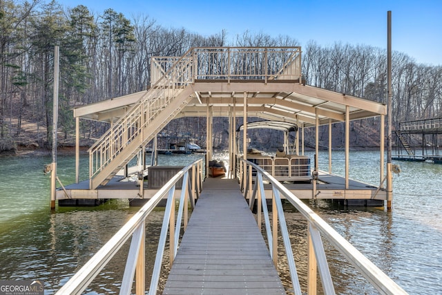 dock area with a water view