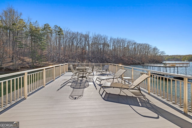 wooden deck with a water view