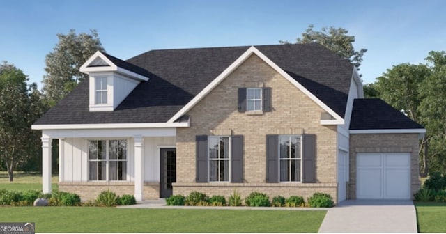 view of front of property featuring a garage and a front yard