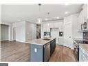 kitchen with white cabinetry and a kitchen island