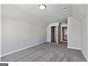 unfurnished living room featuring vaulted ceiling