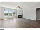 unfurnished living room featuring a fireplace