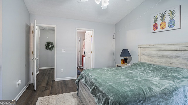 bedroom with dark hardwood / wood-style flooring, a closet, and ceiling fan