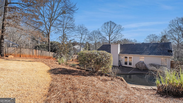 view of property exterior with a pool