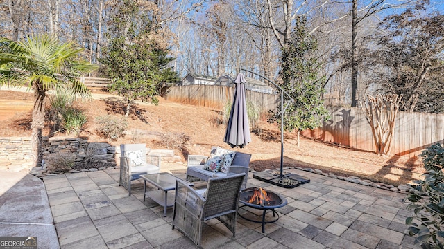 view of patio / terrace with a fire pit