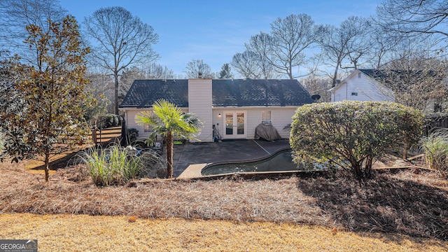 rear view of house with a patio and french doors