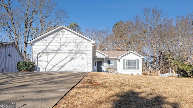 front of property with a garage and a front yard