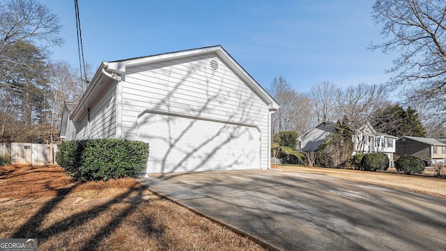 view of side of home with a garage