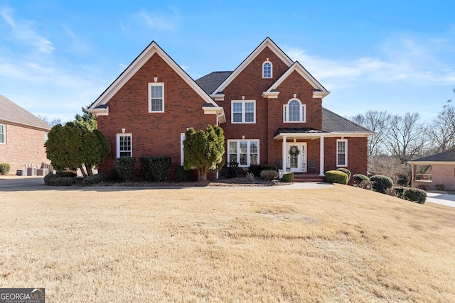 front facade with a front lawn