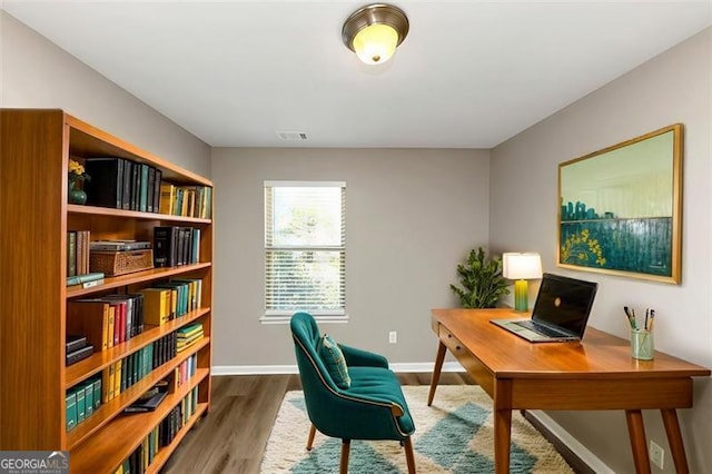 office area with hardwood / wood-style flooring