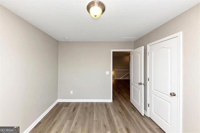 unfurnished bedroom featuring light wood-type flooring