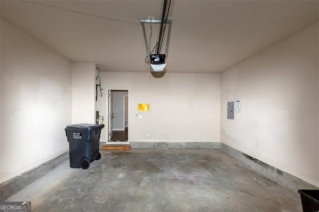 garage featuring a garage door opener and electric panel