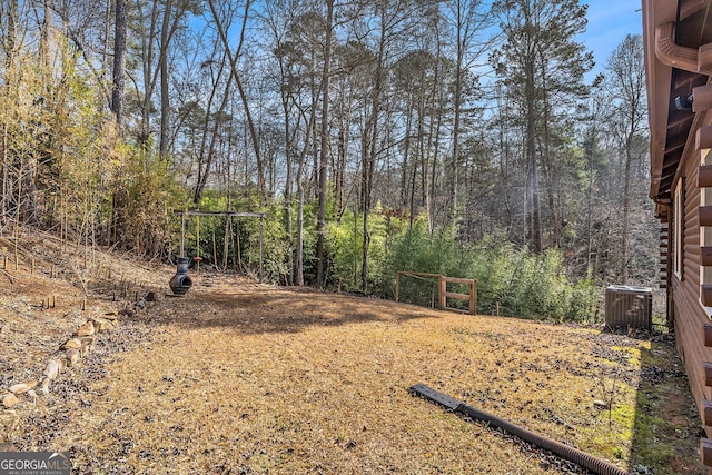 view of yard with central AC