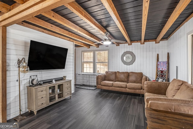 living room featuring dark hardwood / wood-style flooring and beam ceiling