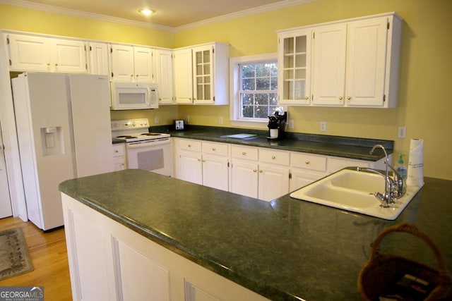 kitchen with sink, crown molding, white appliances, light hardwood / wood-style floors, and white cabinets