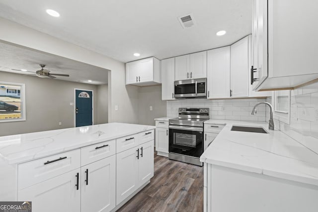 kitchen with white cabinetry, sink, and appliances with stainless steel finishes