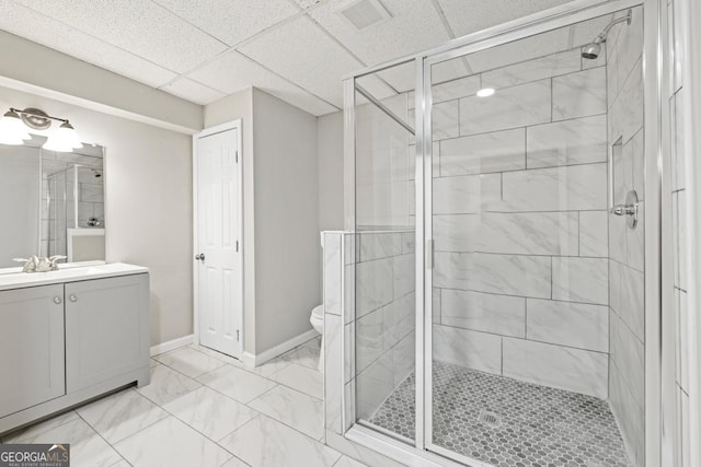 bathroom featuring vanity, an enclosed shower, and toilet