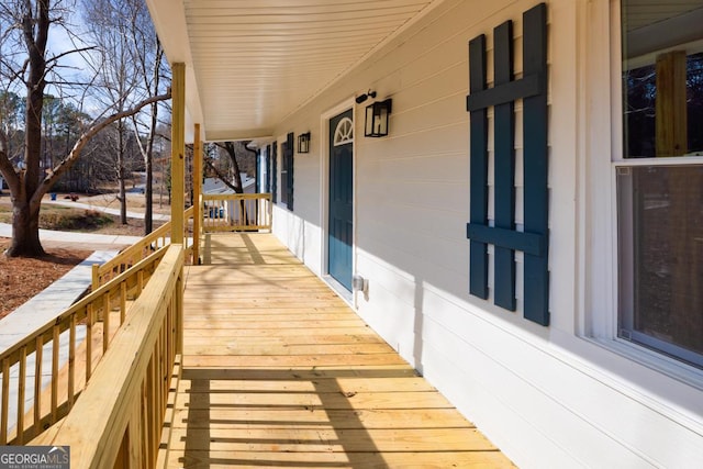 wooden terrace featuring a porch