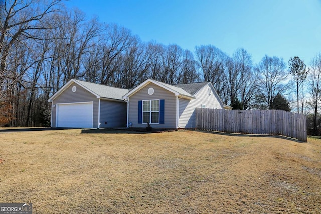 ranch-style house with a garage and a front yard