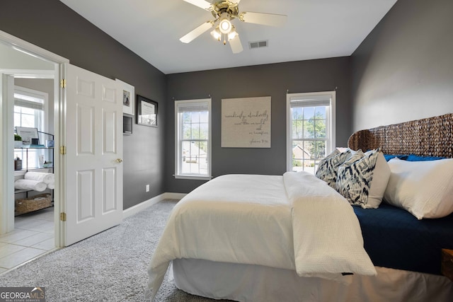 bedroom with light carpet and ceiling fan