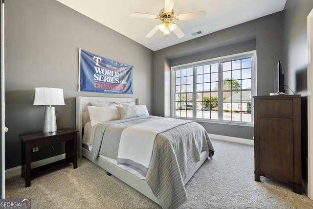 carpeted bedroom with ceiling fan