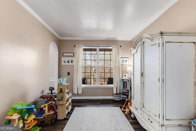 rec room featuring dark hardwood / wood-style flooring and crown molding